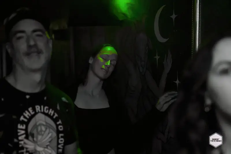 Friends dancing by the moon-and-stars mural. Launch night, May 2025
