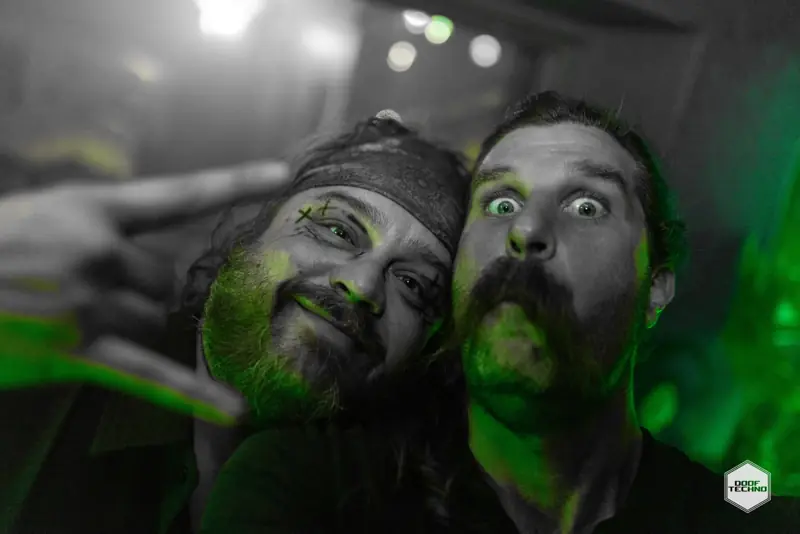 Two mates cheek to cheek, pulling faces for the camera