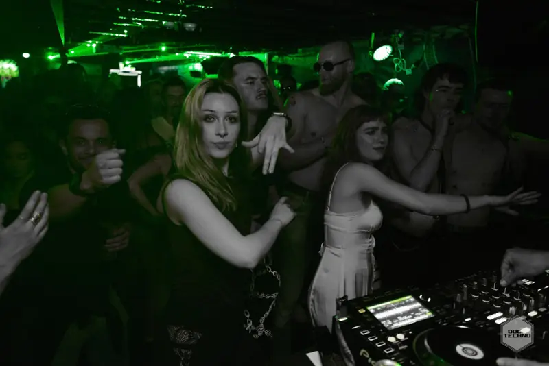 Dancers by the booth with arms out
