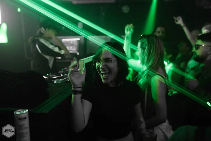 A dancer laughs, drink raised. Kaufmann at Electric Circus, Oct 2026