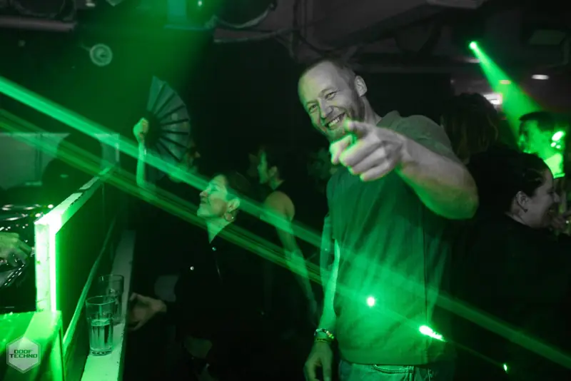 A dancer points at the camera through the lasers. Kaufmann at Electric Circus, Oct 2026