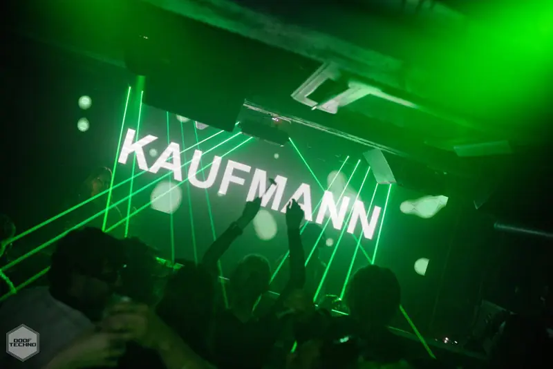 The KAUFMANN sign through a cage of lasers. Kaufmann at Electric Circus, Oct 2026
